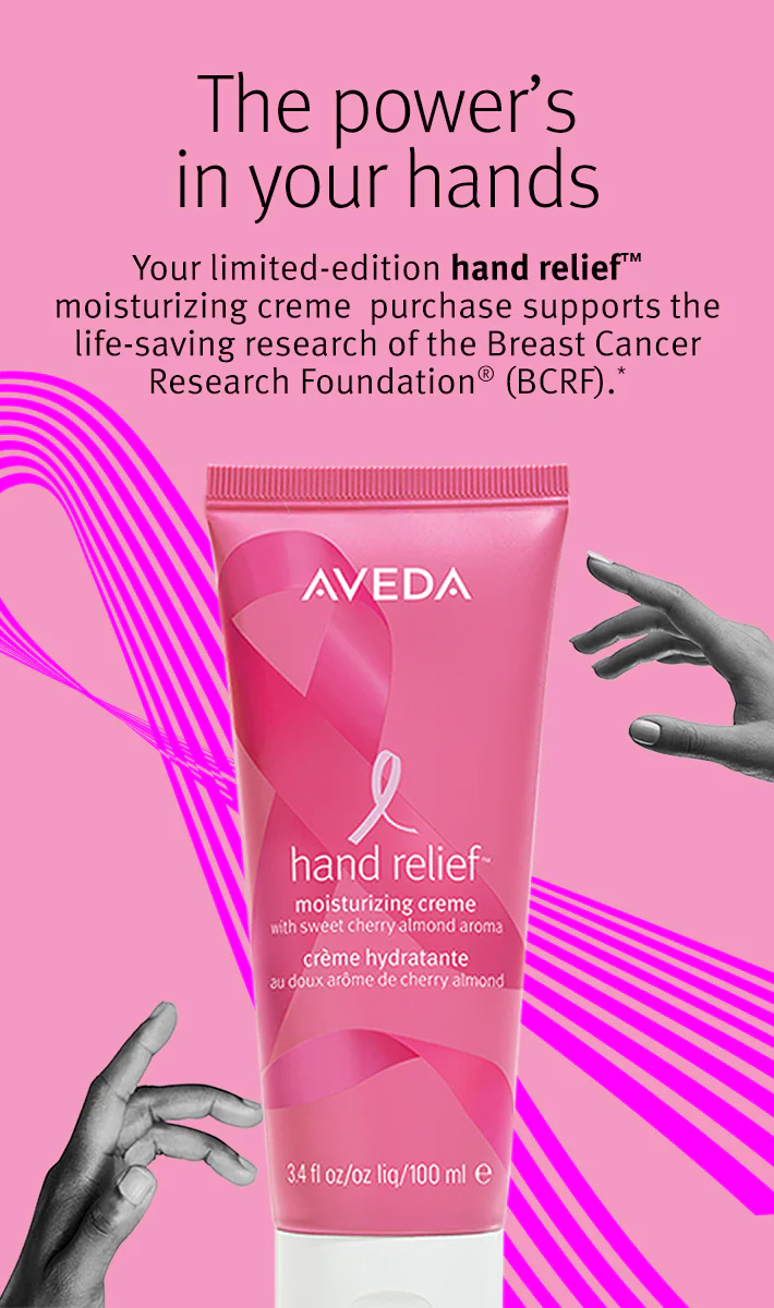 A pink tube of Aveda Hand Relief moisturizer is featured on a pink and black background with text promoting breast cancer research support. - Jax Salon and Spa