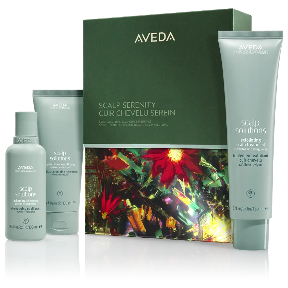 Aveda Scalp Solutions product set displayed, including a spray bottle, shampoo, treatment tube, and decorative box with colorful floral design—perfect for creating event-ready hairstyles and festive hair ideas. - Jax Salon and Spa